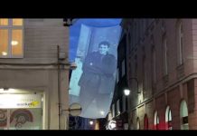 Projekcije ratnih fotografija na platnu u Kulovića ulici